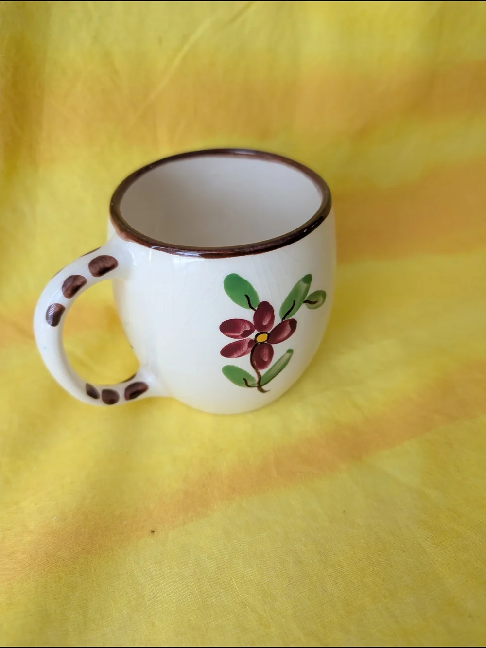 Hand-Painted Cream Ceramic Mug with Brown Trim and Colorful Illustration